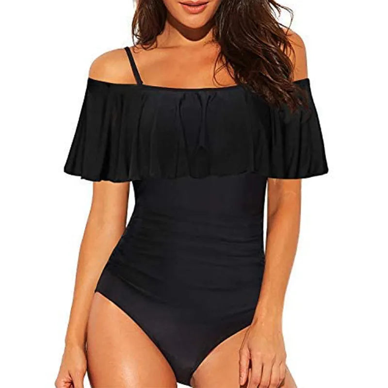 Black one-piece swimsuit with cut-out sides and ruffled shoulder straps
