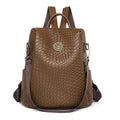 Women's black anti-theft backpack with woven texture design and multiple zipper compartments for travel organisation