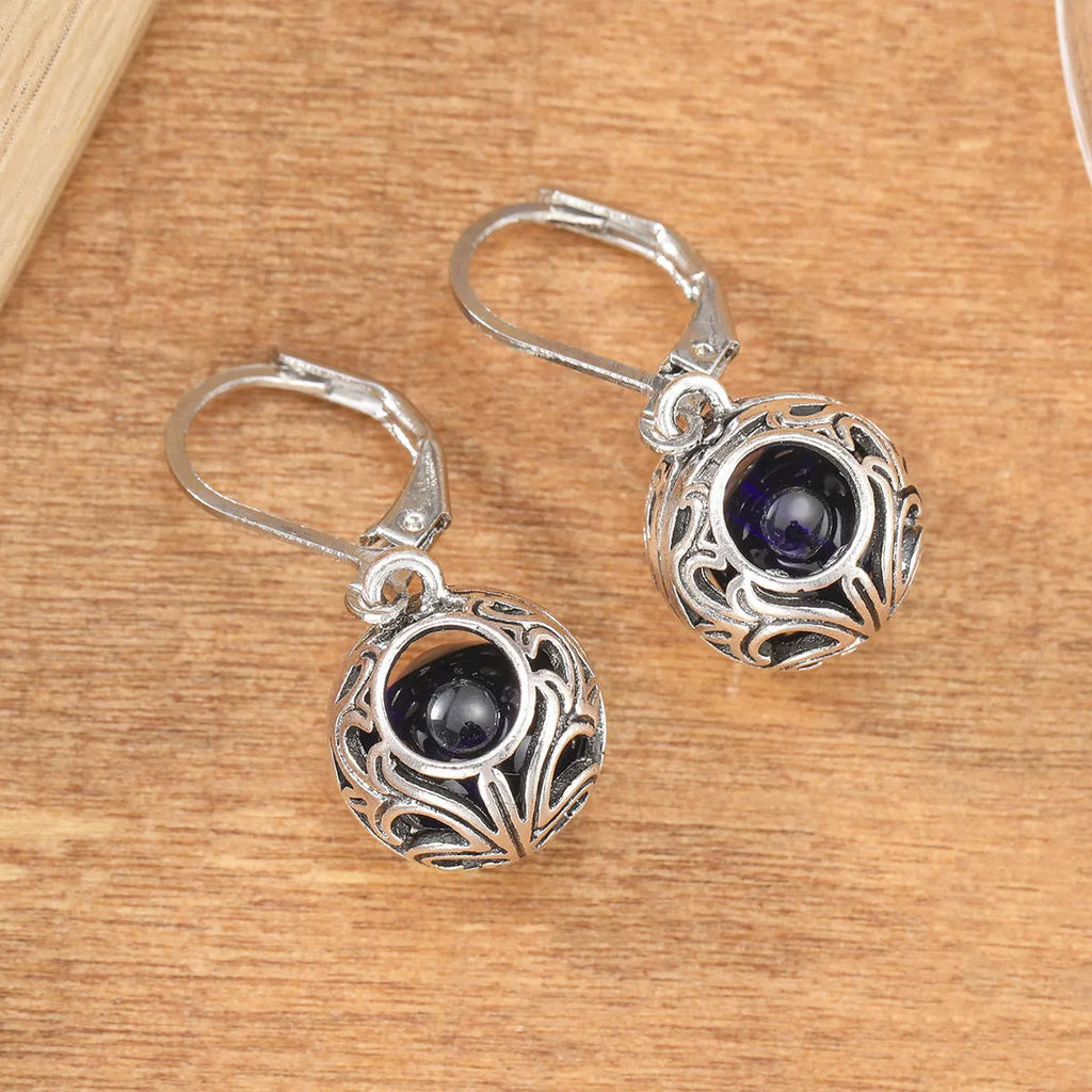 Silver-coloured vintage engraving hollow geometric pendant earrings with blue gemstone