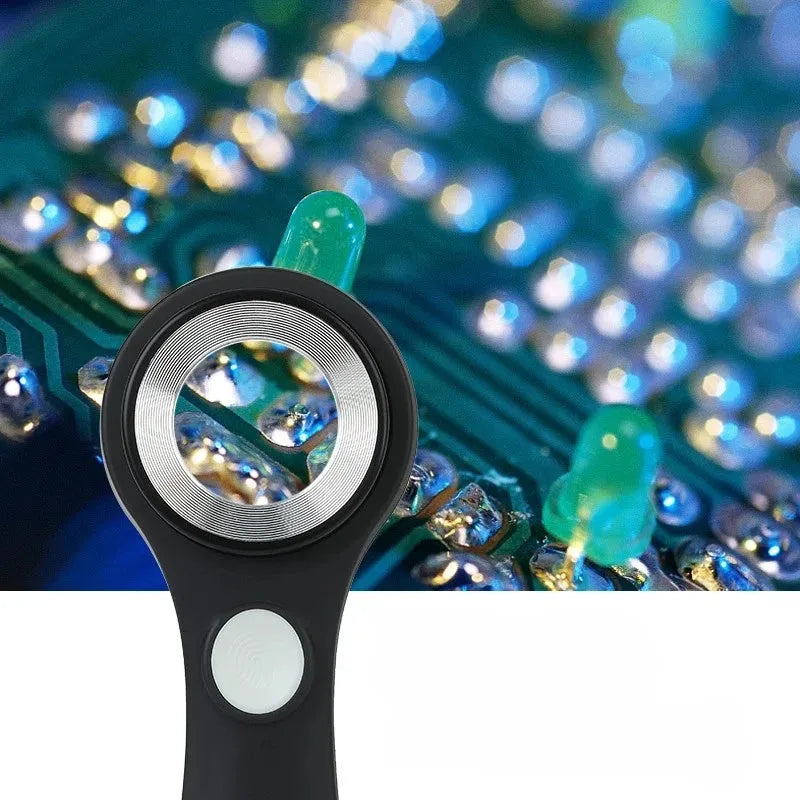 Black and silver electronic magnifying glass for jewellery appraisal with 30X lens and USB C cable.