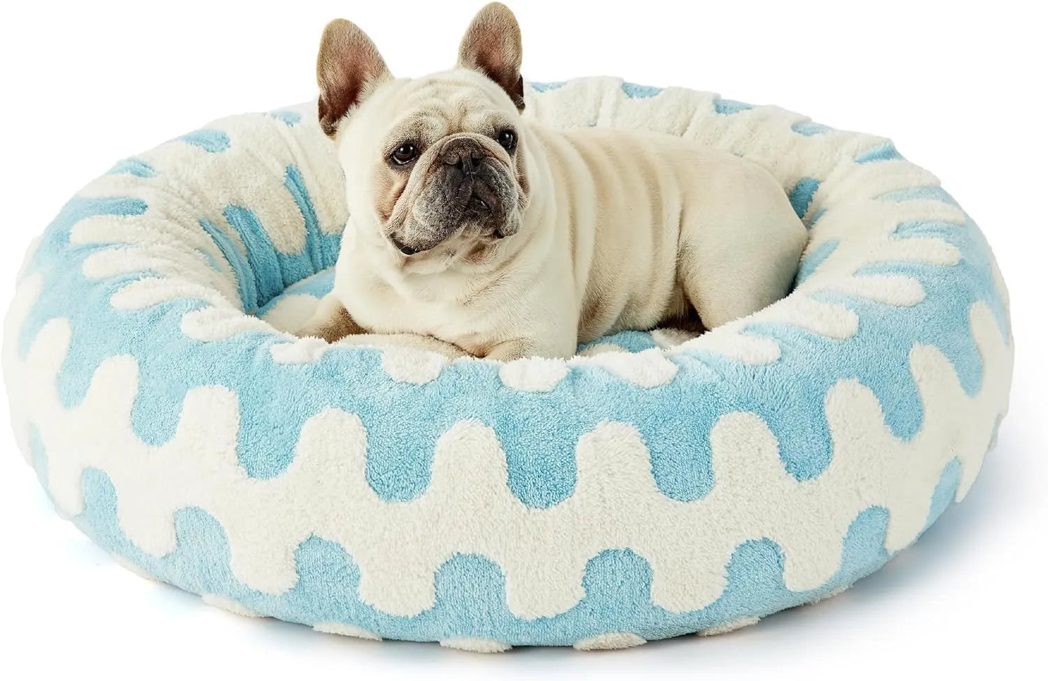 Round plastic dog bed in blue and white plaid pattern showing removable cover option