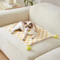Soft plush pet blanket with plaid pattern and fur ball decoration for cats and dogs