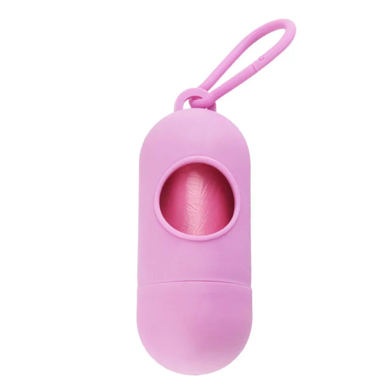 Small, lightweight dog poop bag holder showing side hook and Velcro strap for attachment.