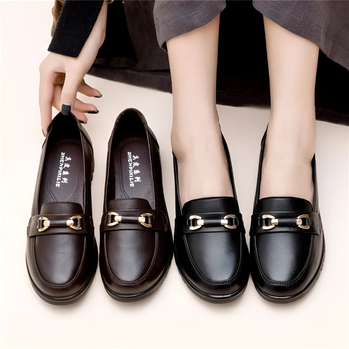 Black soft leather casual pumps with a round toe and low flat heel.