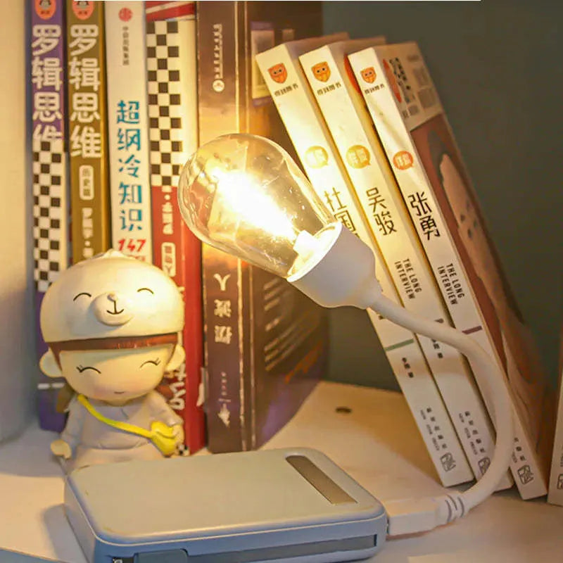 USB rechargeable folding tungsten night light showing warm white illumination