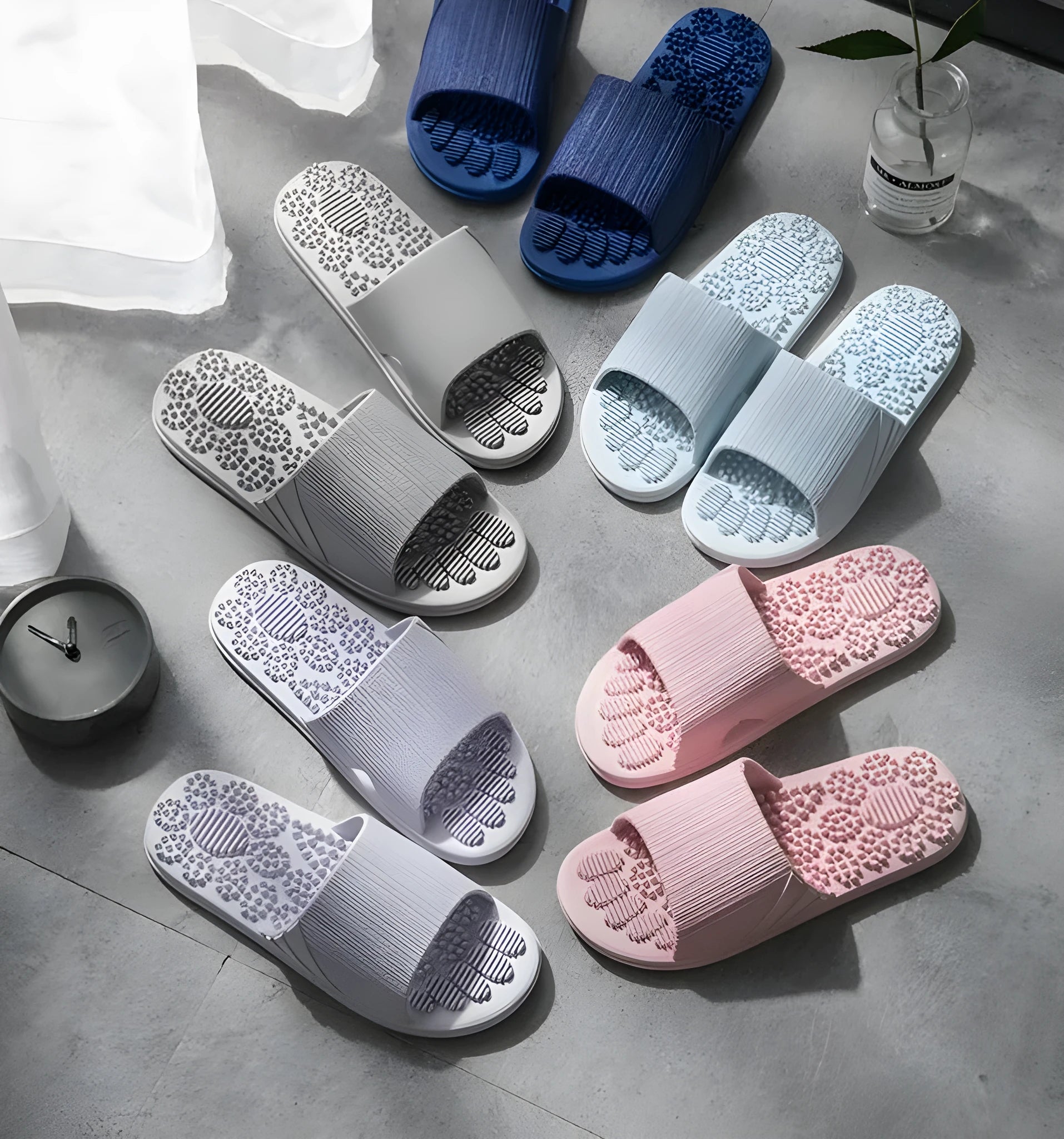 Reflexology acupressure slippers in EVA material with 3D massage particles, available in blue, grey, light blue, pink, purple