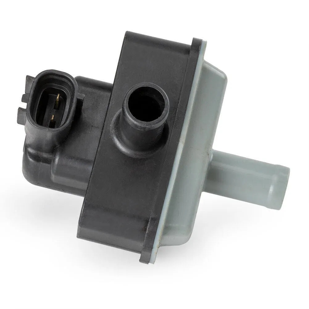 Black Toyota vacuum solenoid valve with model number 90910-12283 visible