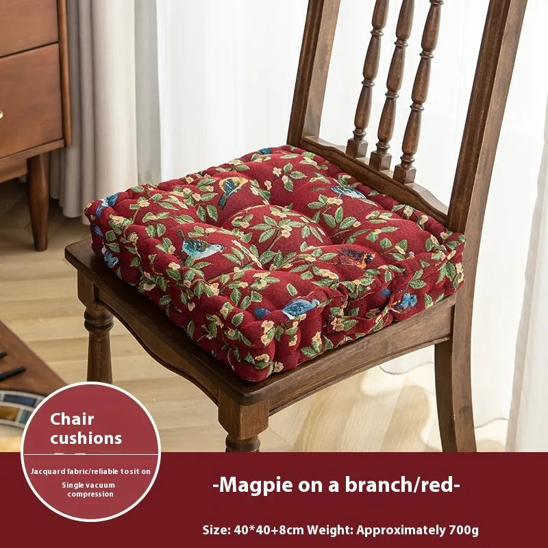 American-style square dining chair cushion with thick padding and botanical print.