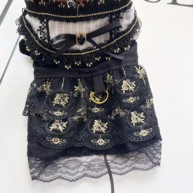 Golden tiered gothic-style skirt for a small dog on a mannequin, showing princess design.