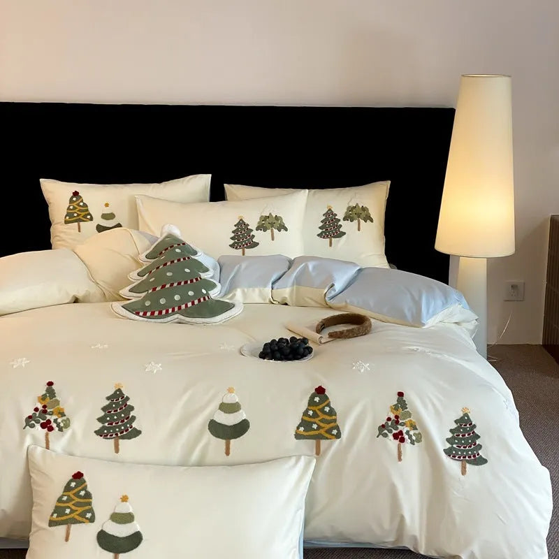 Cream blue duvet cover with embroidered Christmas tree and towel motif, part of a 100% cotton four-piece bedding set.