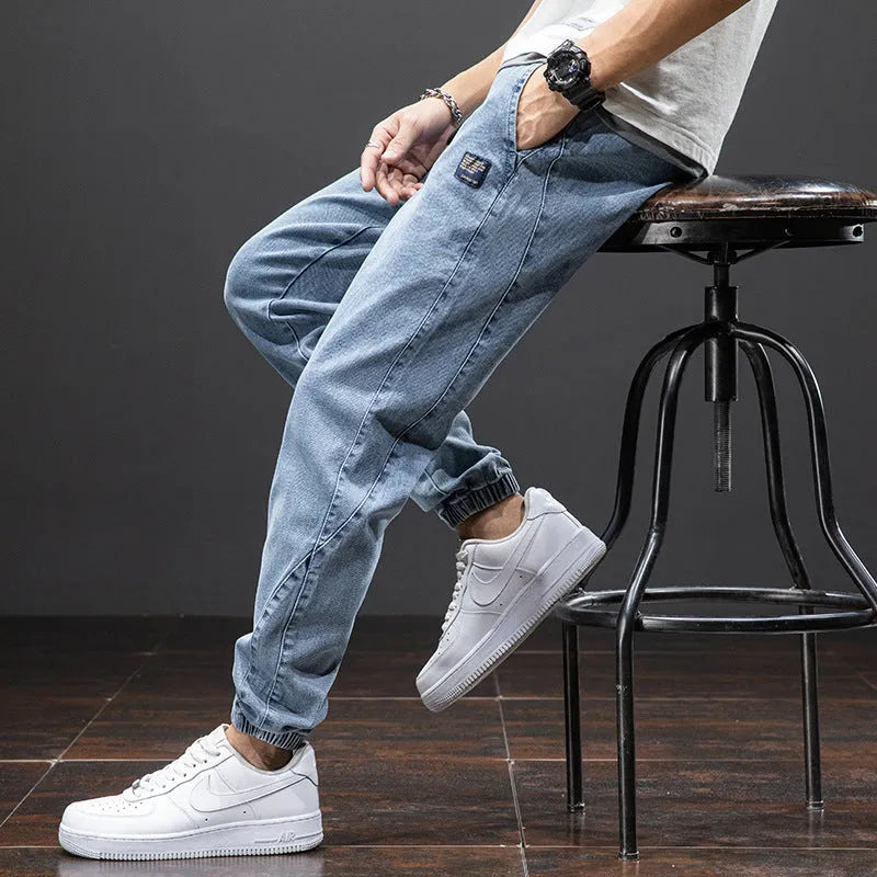 Man wearing loose fit blue cargo jeans with straight leg and cargo pockets