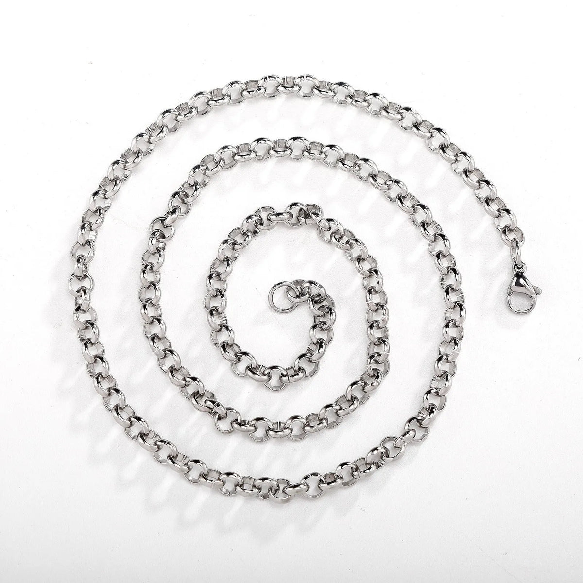 Silver stainless steel men's punk ring buckle necklace with O-ring chain and copper zircon pendant on dark background