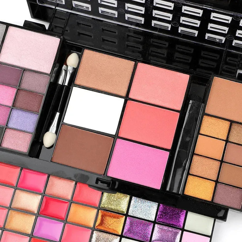 74 colour makeup palette with eyeshadows, lip glosses, concealer, blush and contouring powders in layered plates