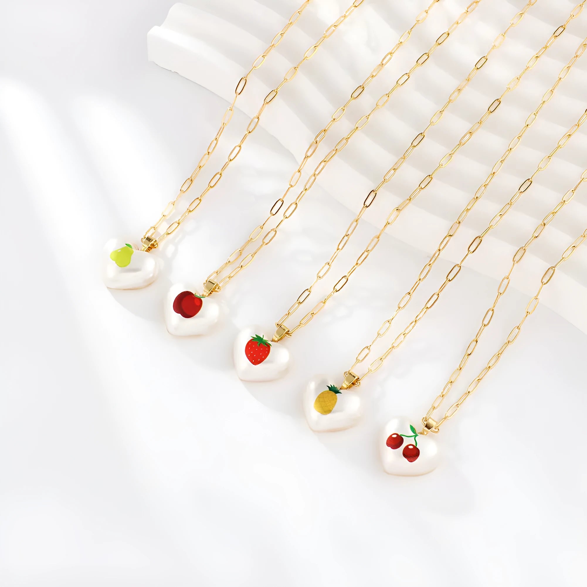 Adjustable necklace with heart charm and fruit pendant on 21-50cm chain