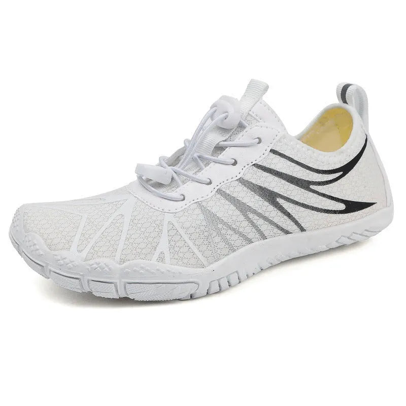 Casual low-top running shoes in black and white colourway with front lace-up closure.