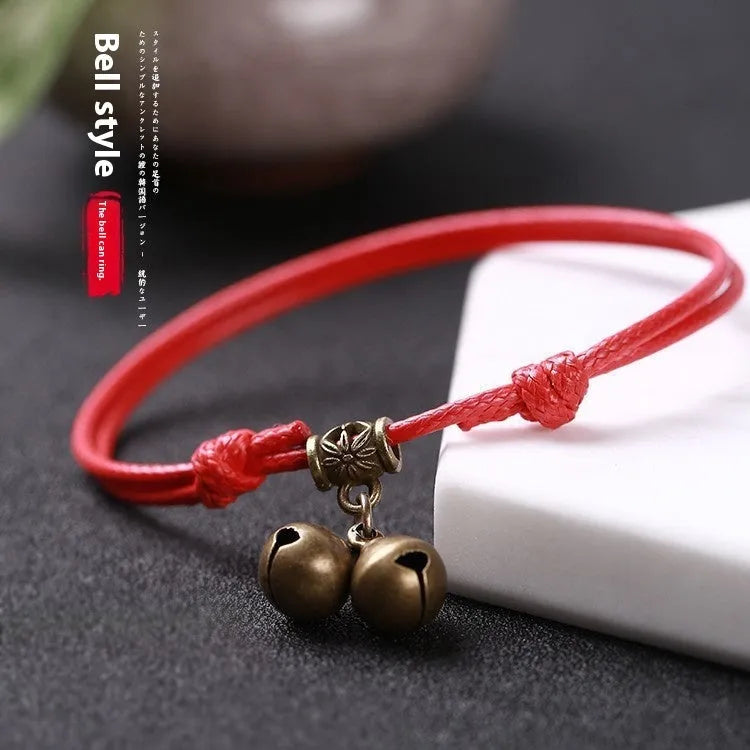 Nylon rope dog collar with brass bell shown in black, red, and coffee colour options on a plain background.