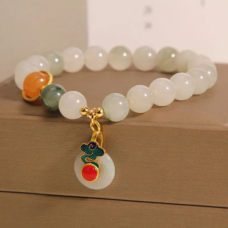Women's ice jade bracelet with pearl accents and carved jade buckle clasp