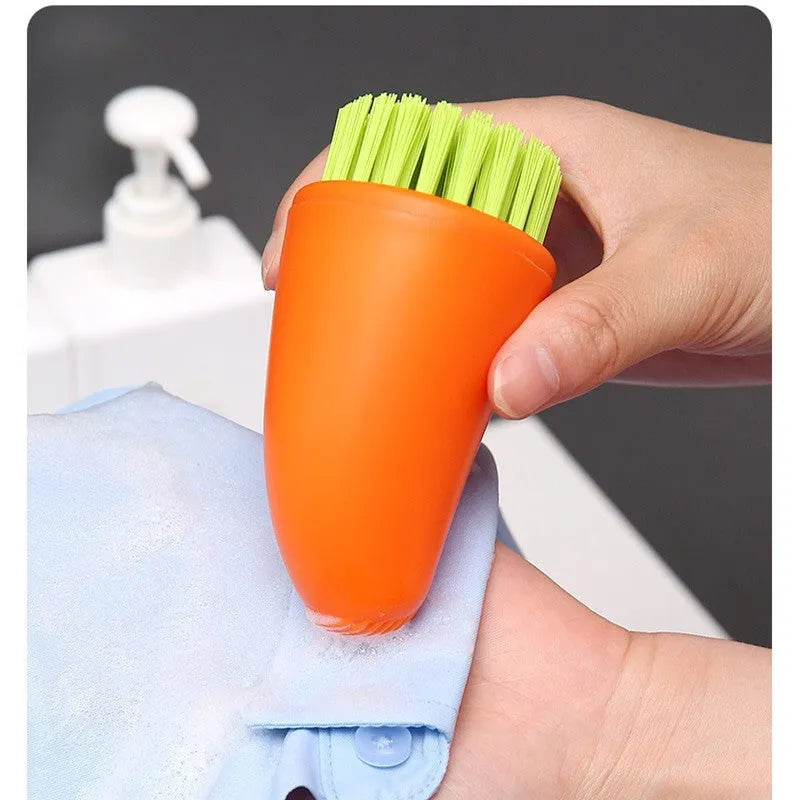 Carrot-shaped nylon cleaning brush in orange and white colours for kitchen vegetable washing