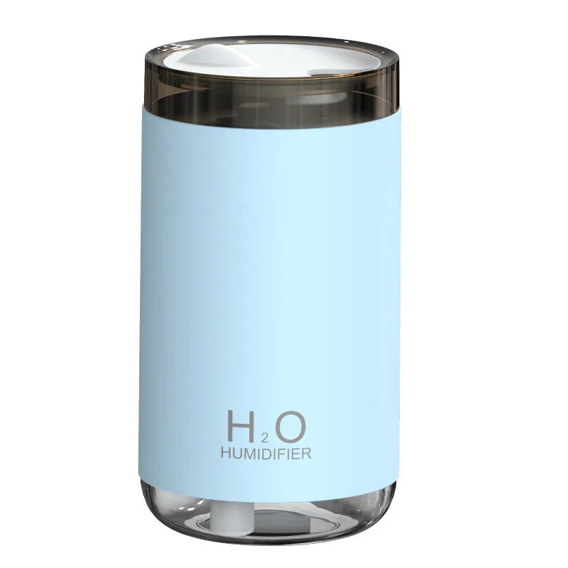 Jellyfish-shaped humidifier producing smoke ring mist with warm night light illumination