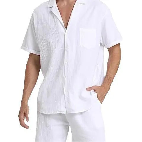 Man wearing a grey flax linen short-sleeved top and matching shorts from the summer sports suit set.