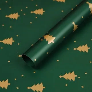Christmas Kraft paper gift wrap sheets with red and green ink printed cartoon designs including polka dots, snowflakes, and Christmas trees