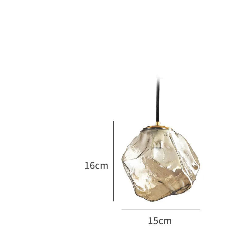 Minimalist ice cube glass chandelier with warm 4000K light, smoky grey shade and black hanging wire over a dining table