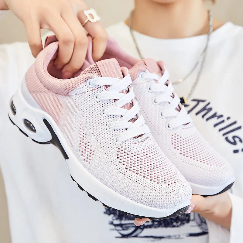 Women's striped flyknit casual running shoes in pink with flat PVC sole and lace-up front