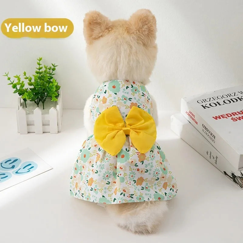 Orange bow floral butterfly pattern polyester dress on a small dog