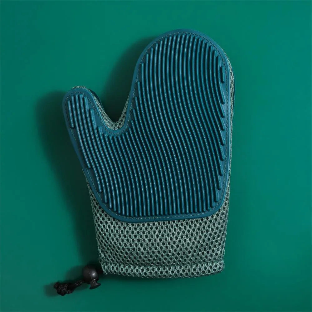 Dark blue pet grooming glove with silicone nubs for removing cat and dog hair.