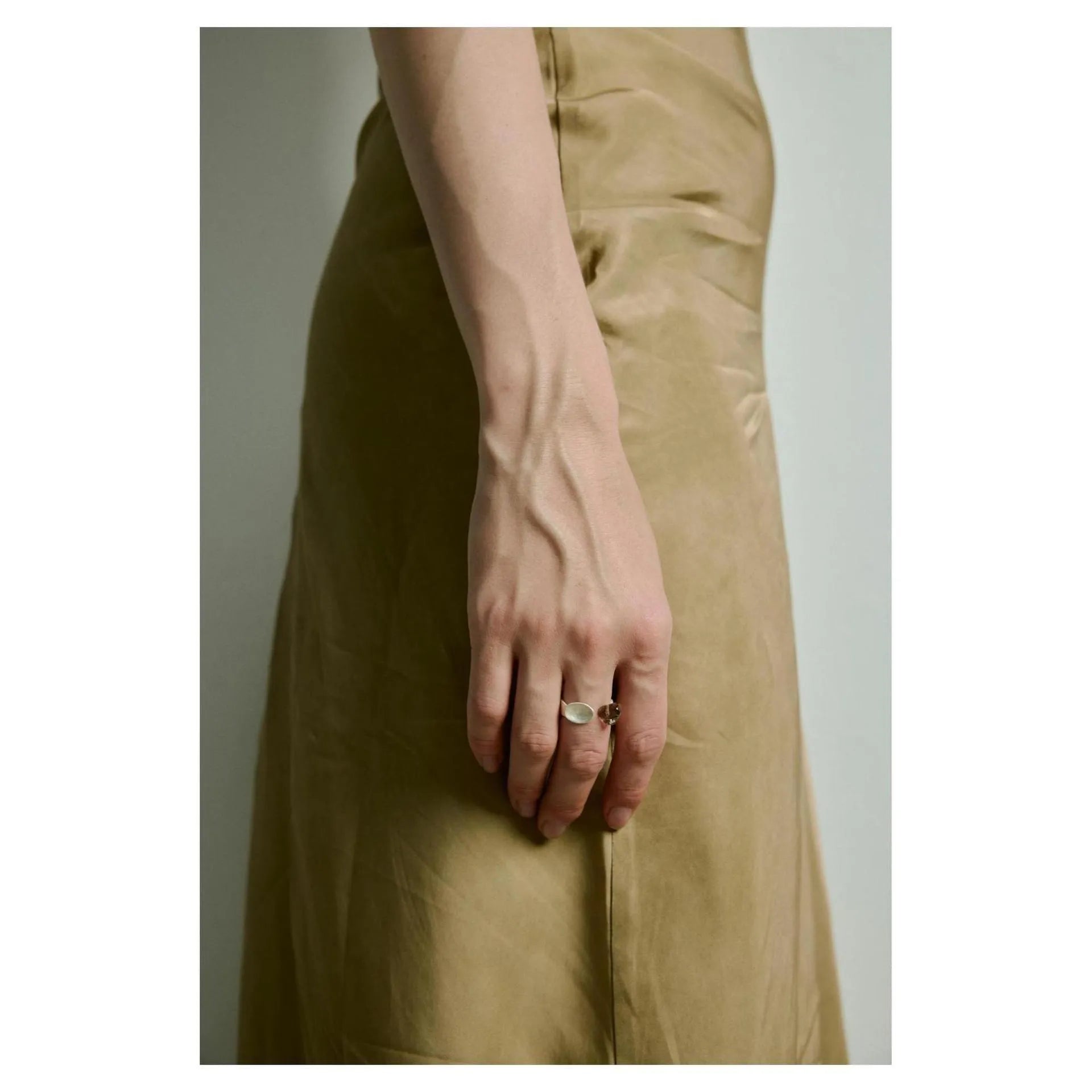 Small electroplated alloy jewellery piece with a diamond shape, shown as a bracelet or ring option.