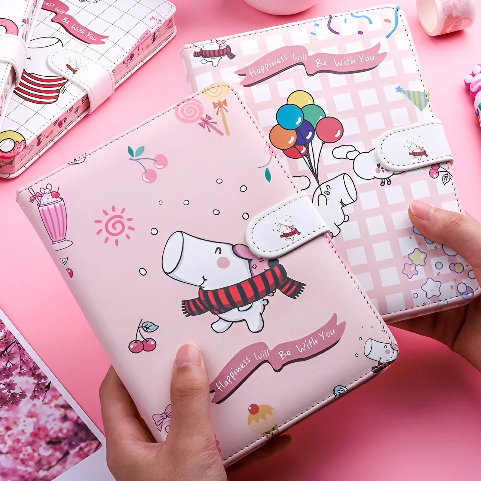 Small white notebook with magnetic buckle showing Kaba Bear Hippo design on PU leather cover