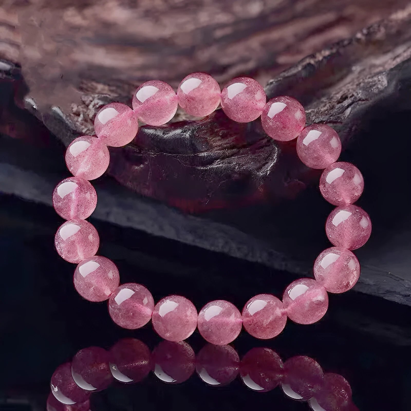 Women's strawberry quartz bracelet with polished crystal beads in choice of 6mm, 8mm or 10mm sizes