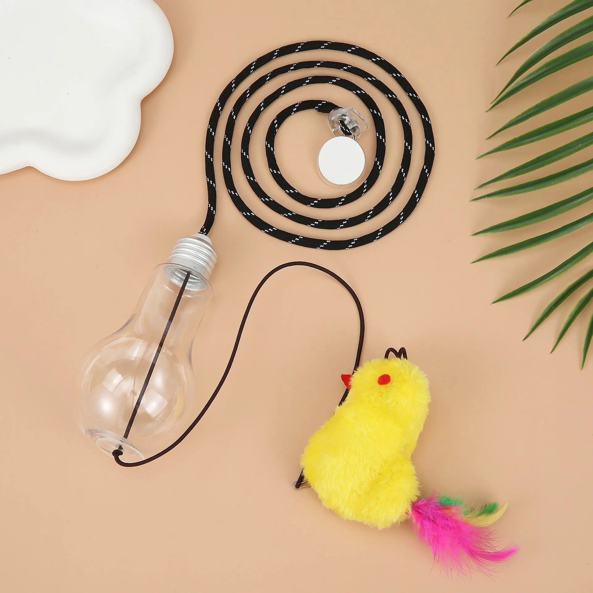 Grey and yellow interactive hanging cat toy with retractable rope, treat bulb, and mouse attachment.