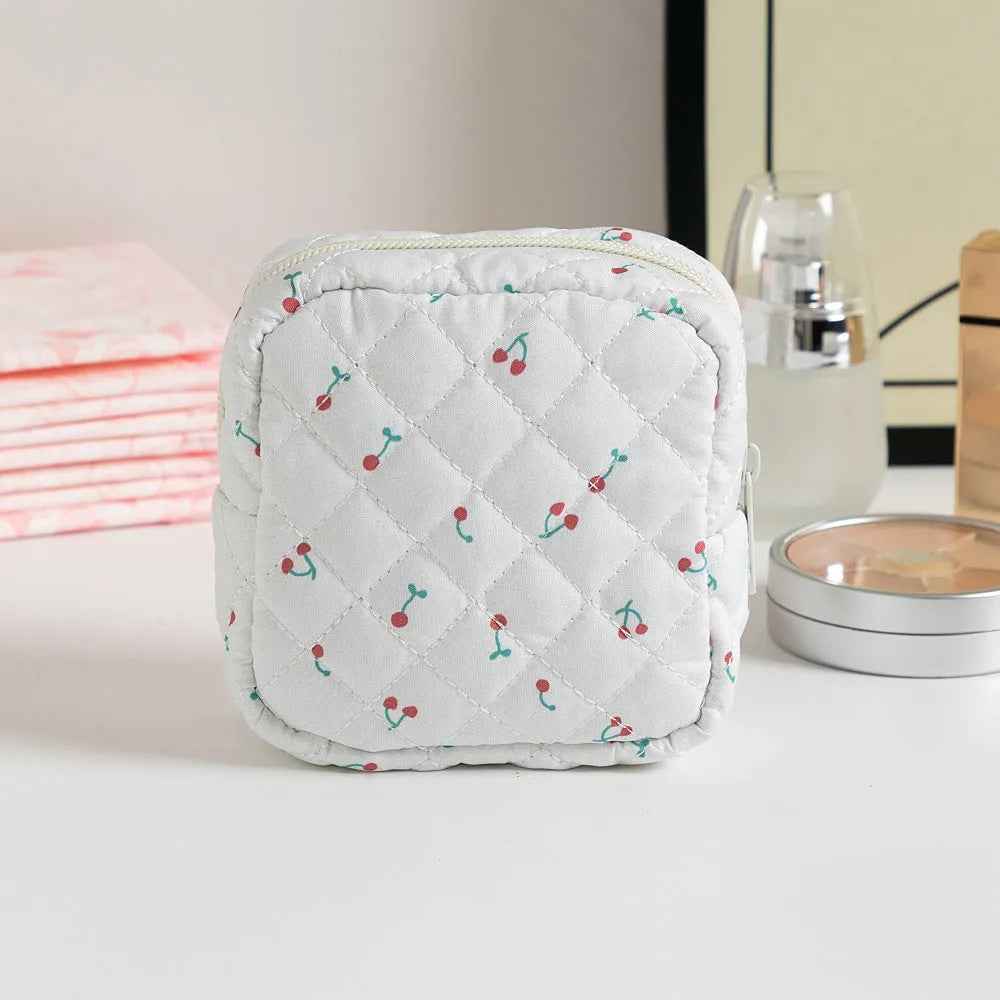 Floral pattern key storage bag made from breathable polyester fabric in various colour options.