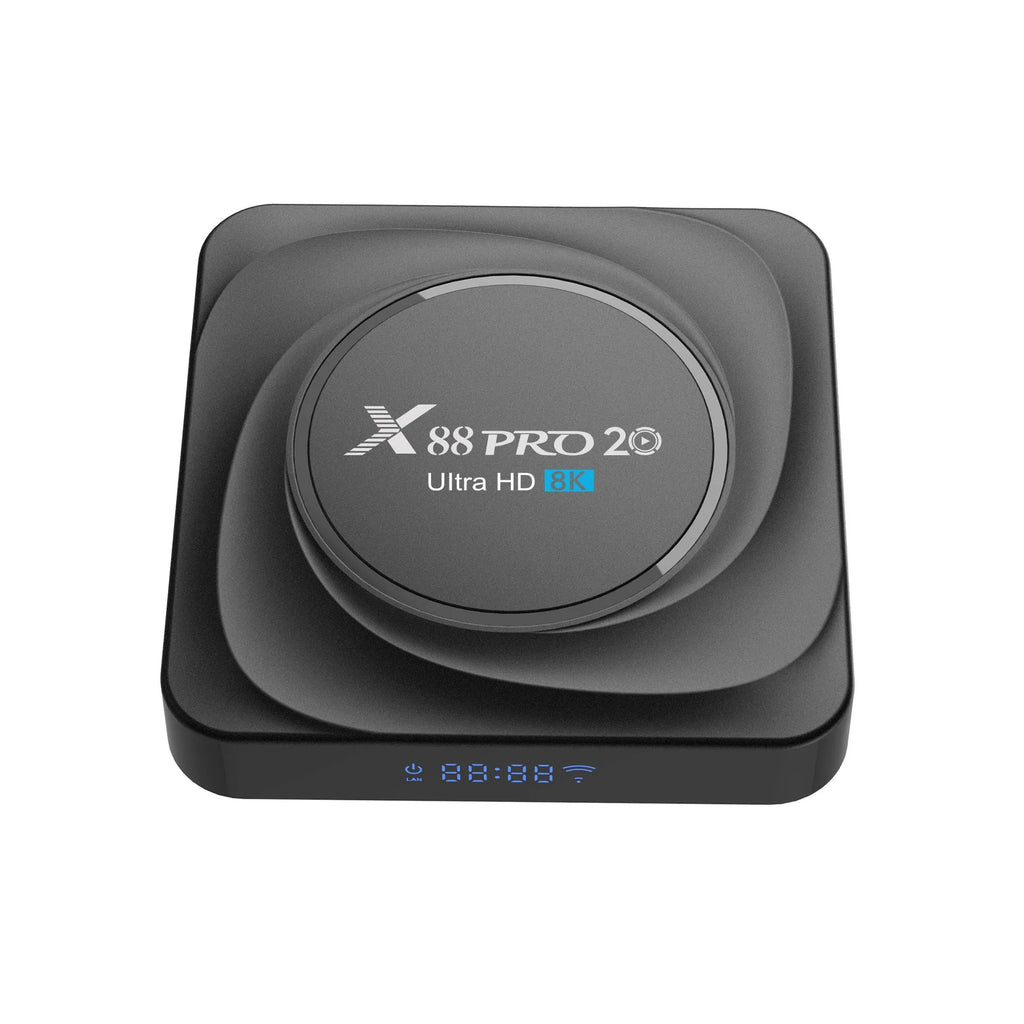 Android set-top TV box with remote control on a wooden surface