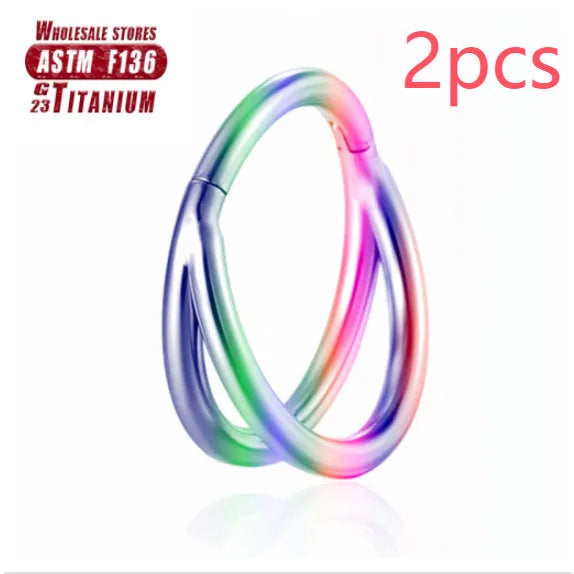 Titanium alloy fork nose ring in silver colour on a grey background