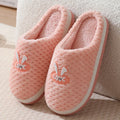 Women's rabbit plaid artificial fur house slippers with a flat heel and rubber sole, shown in apricot colour.