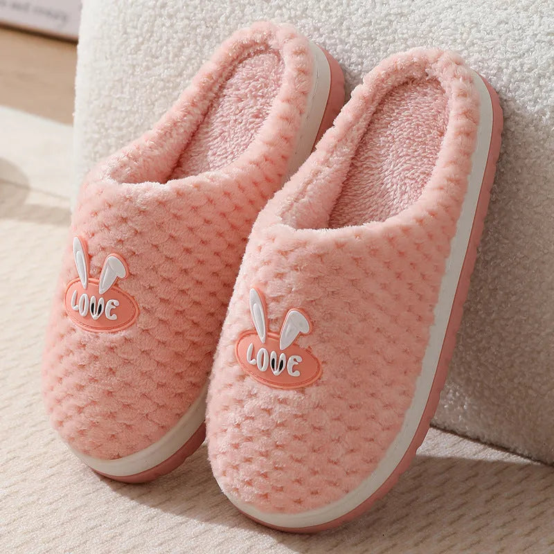 Women's rabbit plaid artificial fur house slippers with a flat heel and rubber sole, shown in apricot colour.
