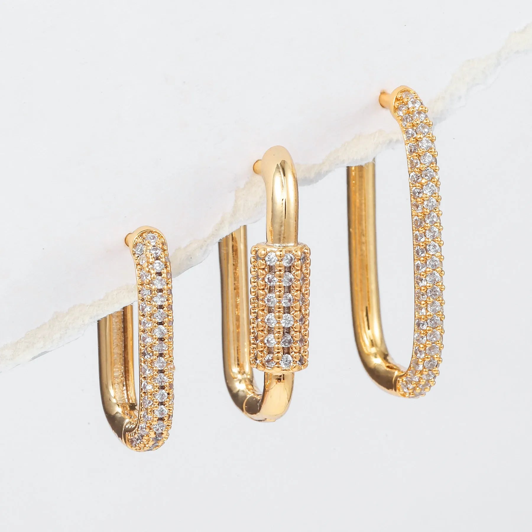 Three geometric square ear clips with micro inlaid zircon in gold and white K colours