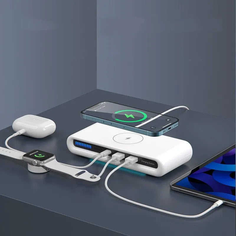 White desktop wireless charger with atmospheric lighting and phone charging on surface