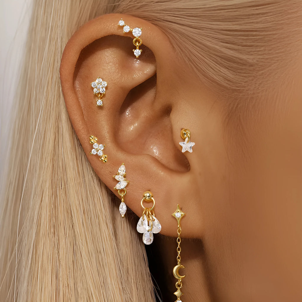 S925 sterling silver geometric moon earring with embedded star design in a gold colour.