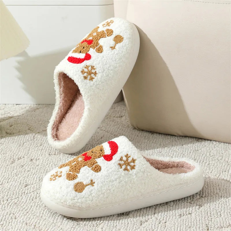 Christmas snowflake gingerbread pattern slippers with plush upper and TPR sole on a wooden floor