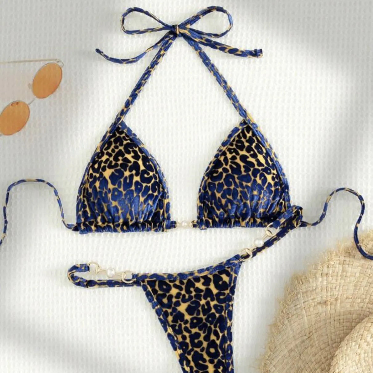 Women's blue leopard print T-shaped swimwear bikini set made from polyester and spandex fabric.