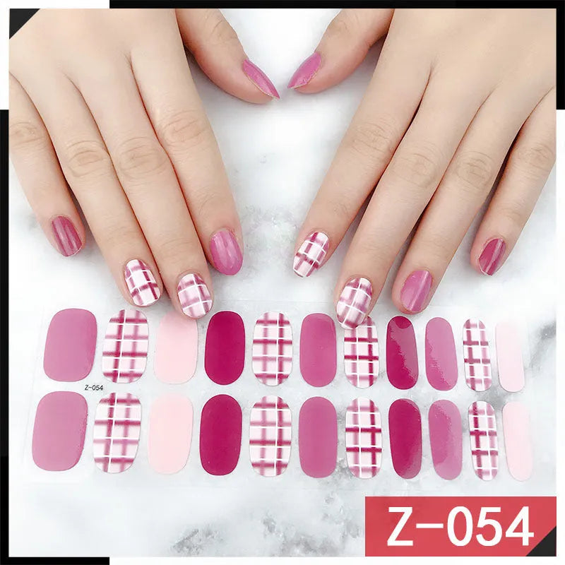 Korean nail stickers kit showing cartoon, strawberry, flower and bow patterns with included nail file