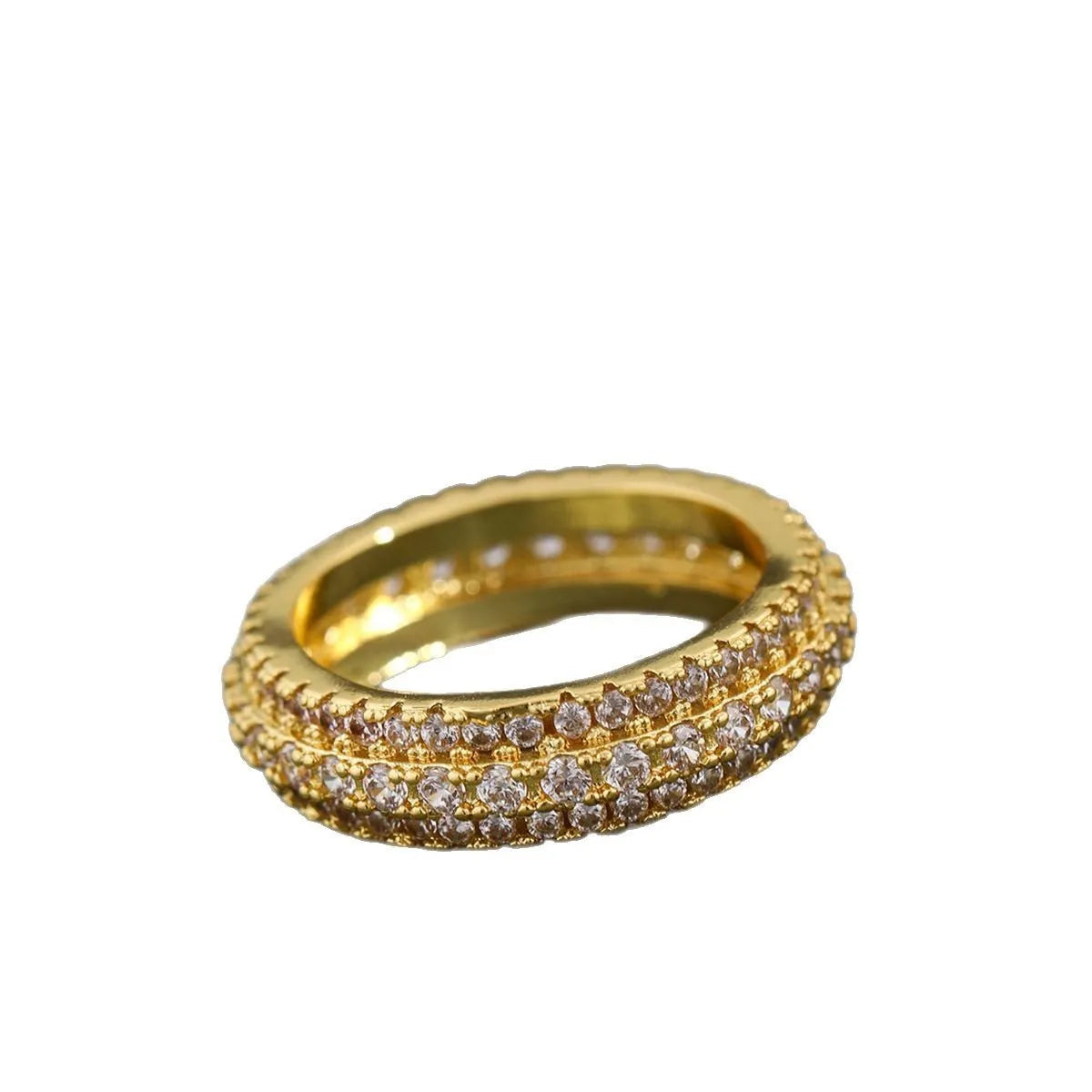 Geometric copper ring with a triangular zircon stone, shown in white gold finish on a finger.