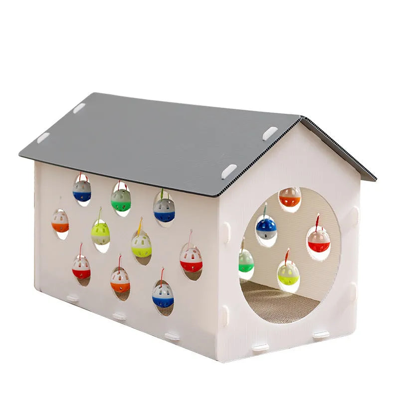 Durable plastic cat scratch board with an attached tunnel and a dangling bell ball toy on a neutral carpet.