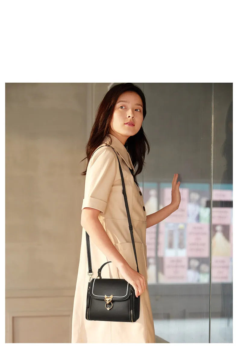 Women's split leather crossbody handbag in black, red or brown with zipper closure and large capacity
