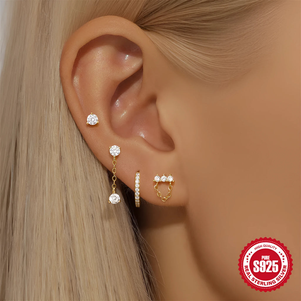 Simple geometric sterling silver earrings with a clover petal design and electroplated gold accents.