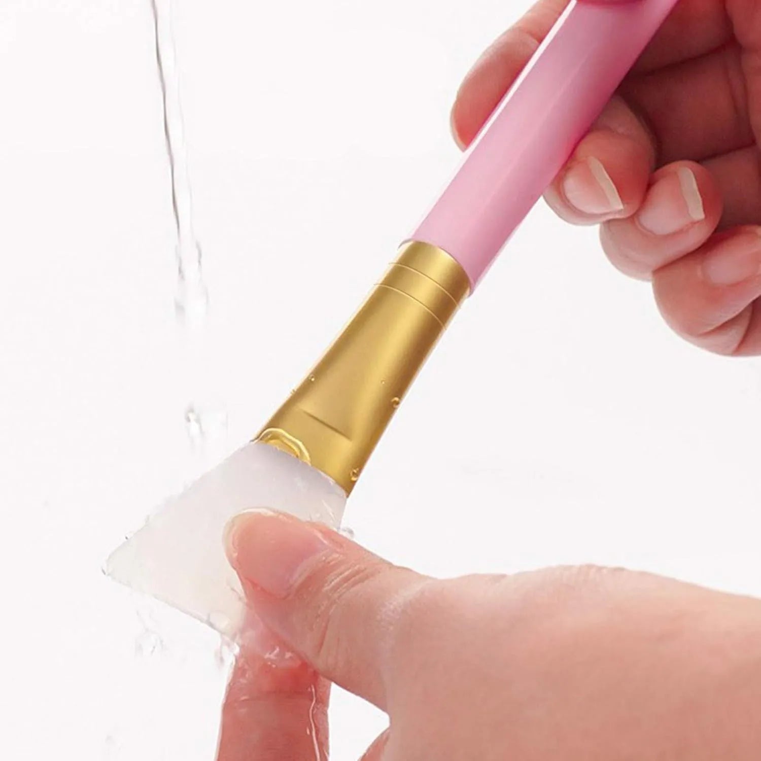 Reusable silicone face and body mask applicator spatula in assorted colours.
