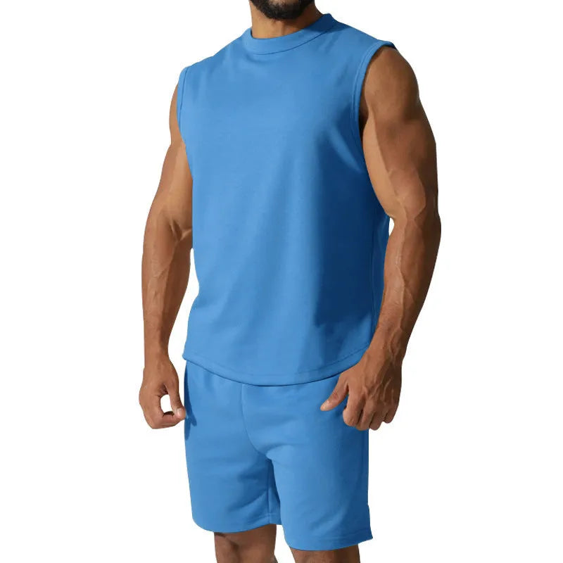 Men's sleeveless cotton blend sports top and matching shorts in a solid colour, laid flat.